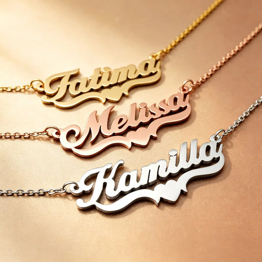 Examples of personalized pet name necklaces in different font styles, showcasing custom stainless steel jewelry for pet lovers.