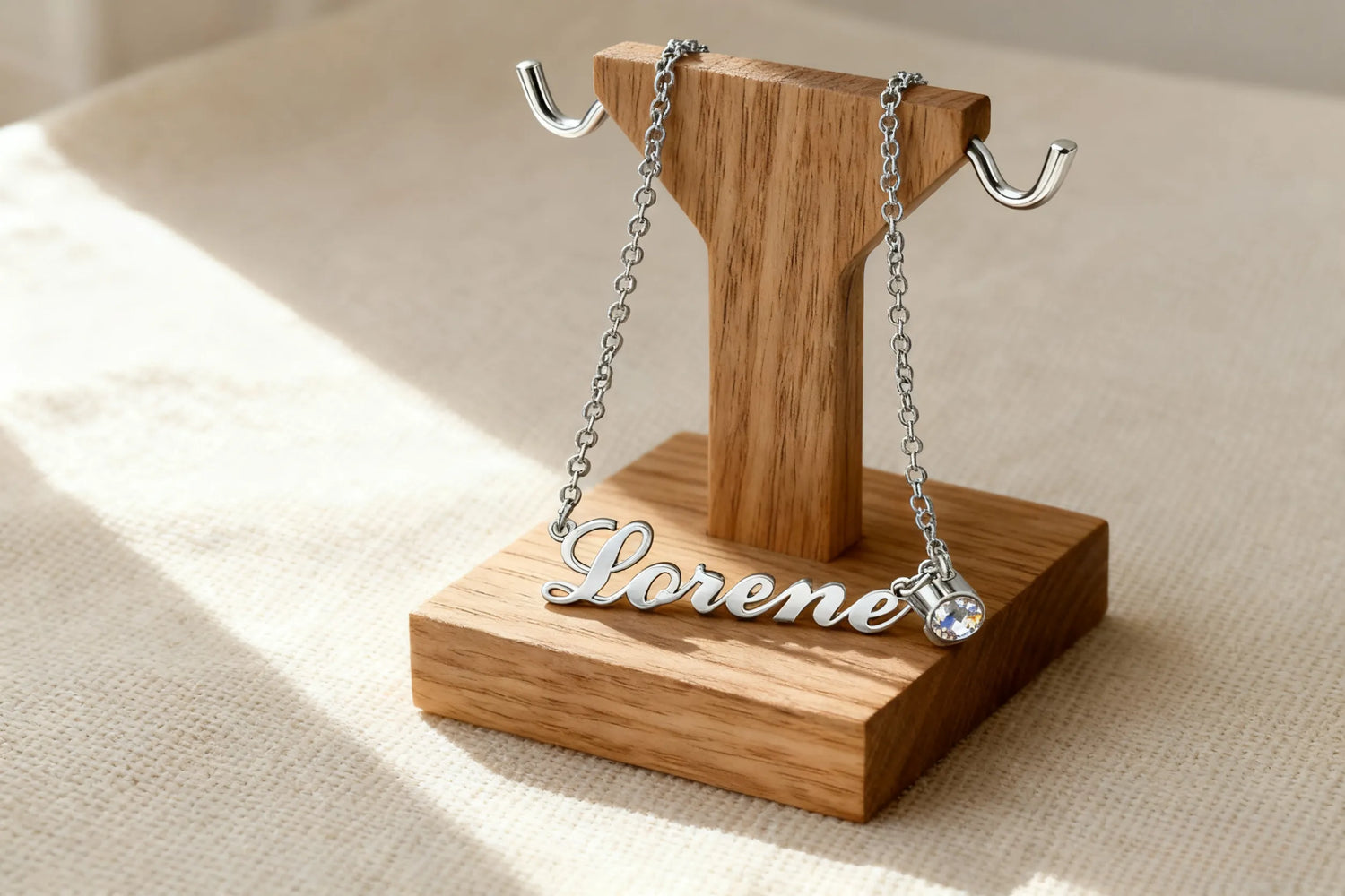 Custom-made pet keepsake necklaces are displayed on the shelf.