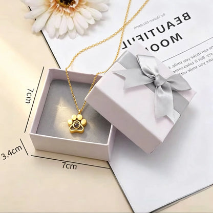 Elegant gift box packaging for the custom paw print projection necklace, ready for birthdays, adoption celebrations, memorials, and meaningful gifts.