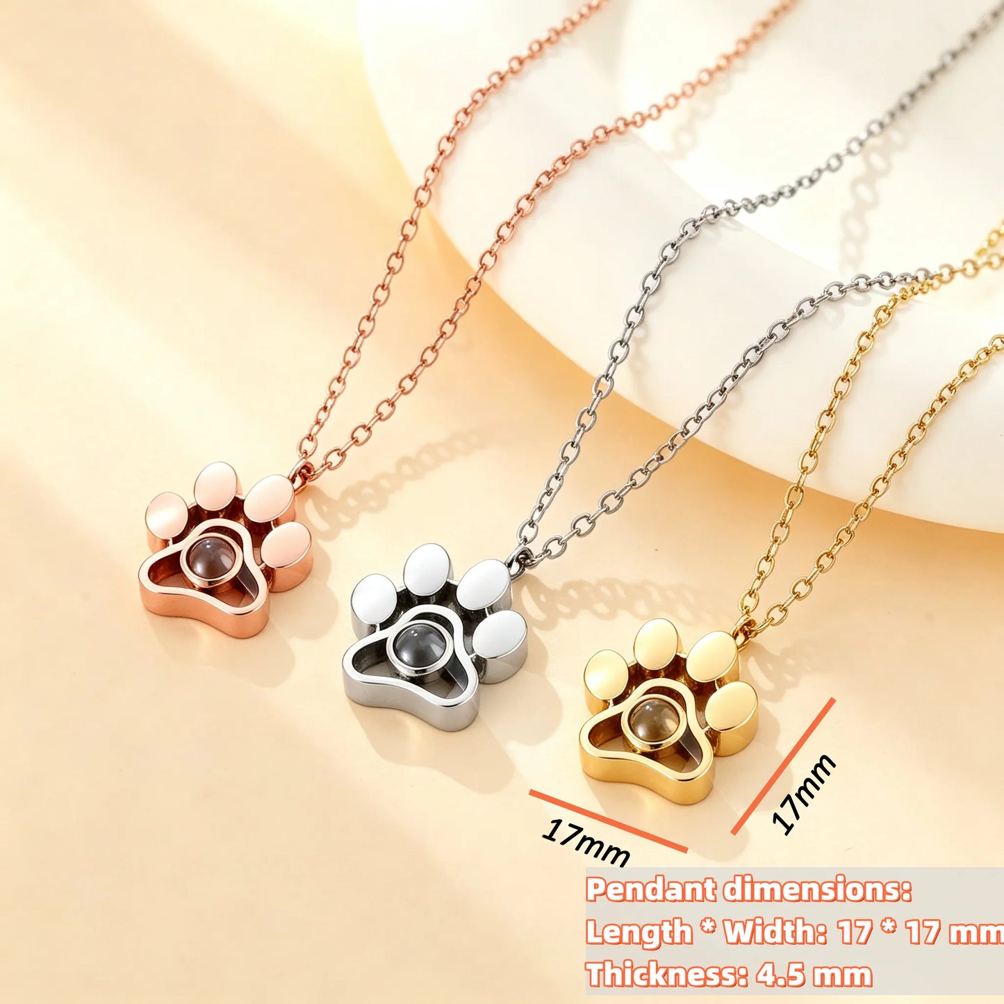 Custom paw print projection necklace available in gold, silver, and rose gold finishes to match every personal style and treasured pet memory.