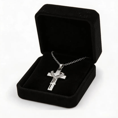 Pet memorial cross necklace displayed with an elegant gift box