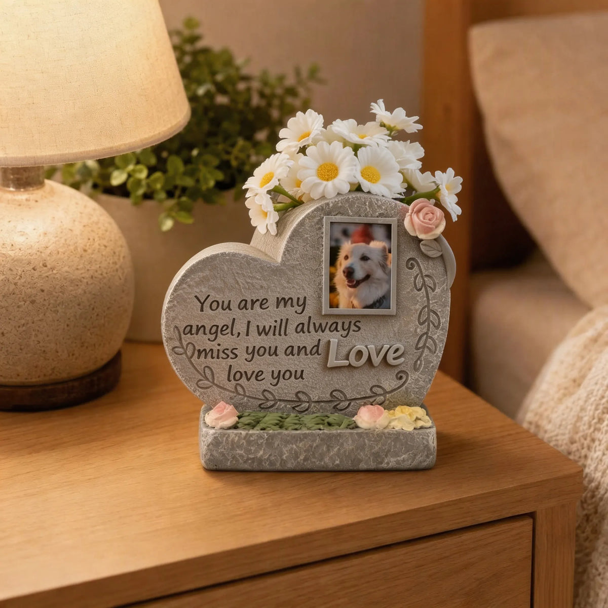 Heart-shaped pet memorial photo keepsake displayed on a home side table