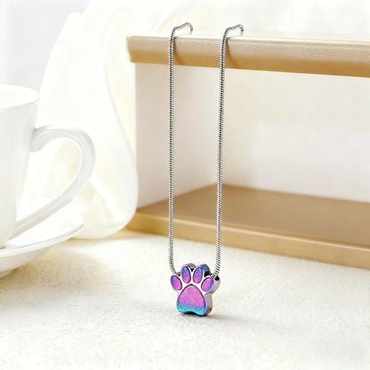 Pet cremation urn necklace for ashes displayed on a wooden frame, pet loss gift for pet lovers