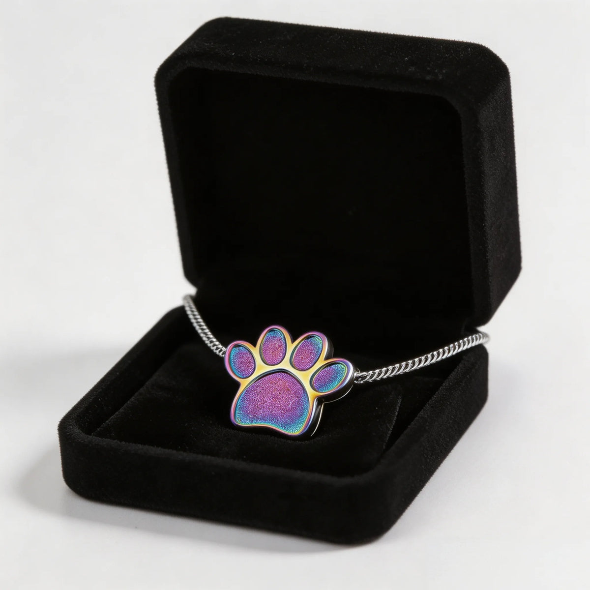 Pet memorial paw print necklace displayed with an elegant gift box