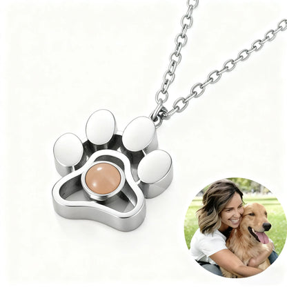 Silver stainless steel paw print projection necklace personalized with your pet photo, designed to celebrate every cherished memory together.