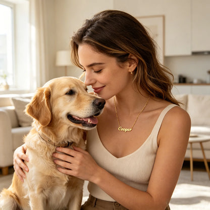 A pet owner wearing a custom pet name necklace while sharing a loving moment with her dog, celebrating every stage of their journey together.